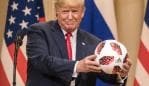 HELSINKI, FINLAND - JULY 16: U.S. President Donald Trump (L) poses with a football given to him by Russian President Vladimir Putin during a joint press conference after their summit on July 16, 2018 in Helsinki, Finland. The two leaders met one-on-one and discussed a range of issues including the 2016 U.S Election collusion. (Photo by Chris McGrath/Getty Images) *** BESTPIX ***