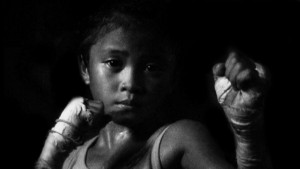 Is child boxing in Thailand about sport or work?